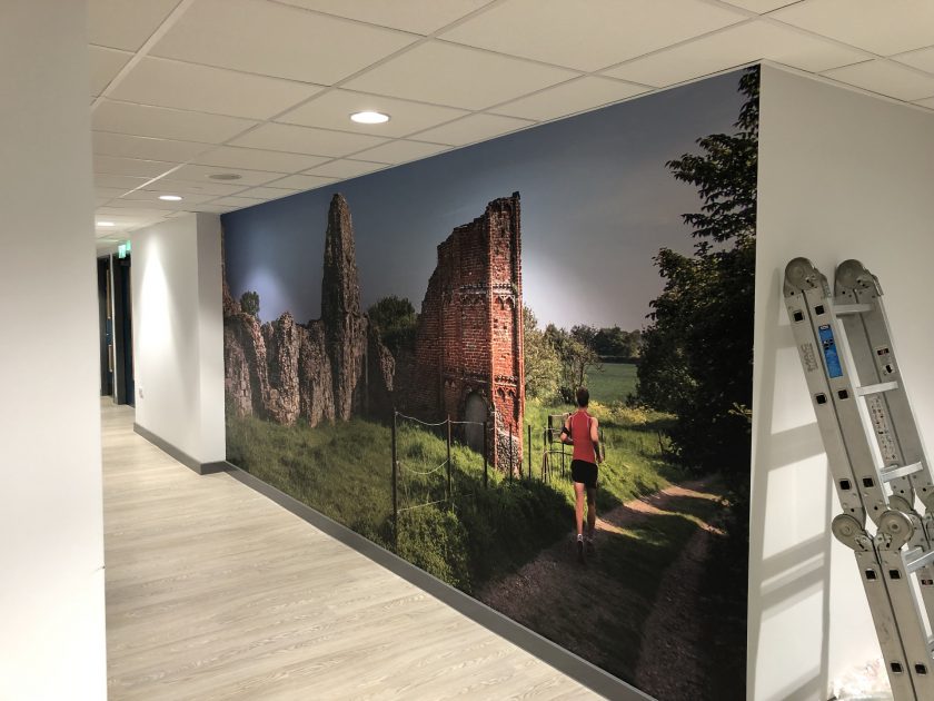 full colour wall graphic of a castle and jogger. Produced by Impact Signs.
